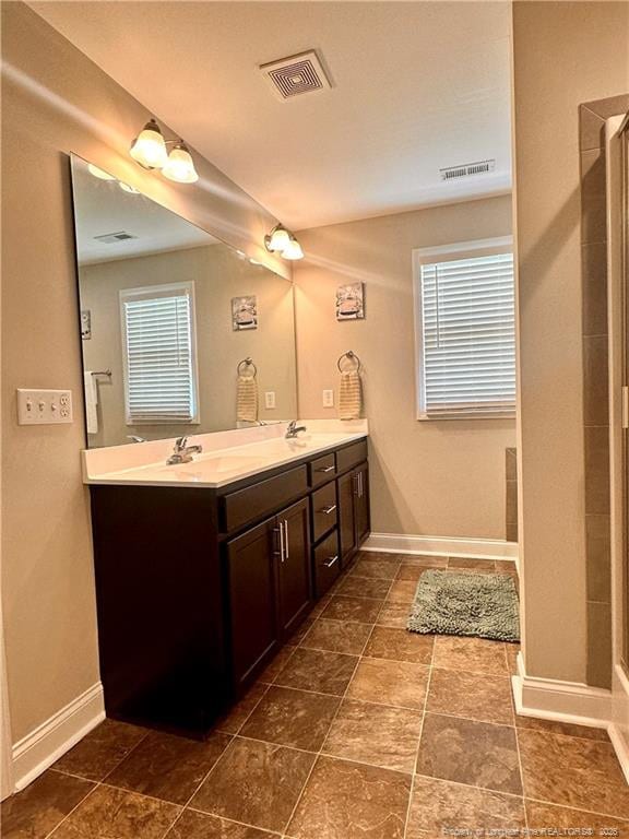 bathroom featuring vanity and walk in shower