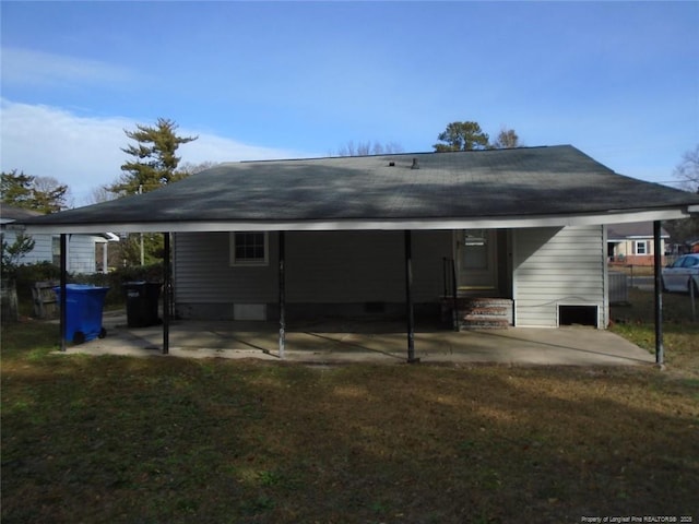 rear view of house featuring a yard