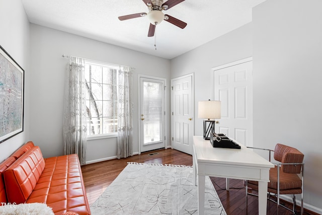 office space featuring ceiling fan and hardwood / wood-style flooring