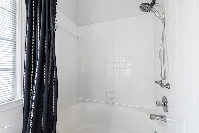 bathroom with shower / bath combination with curtain