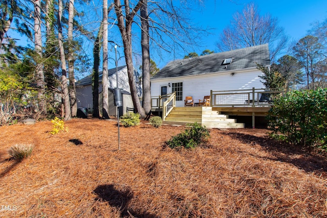 back of property featuring a deck