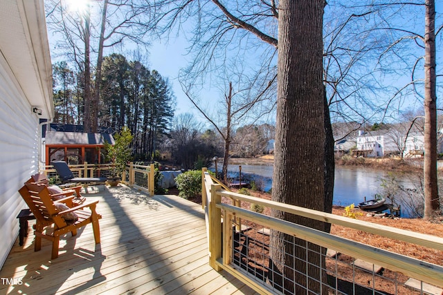 wooden deck featuring a water view