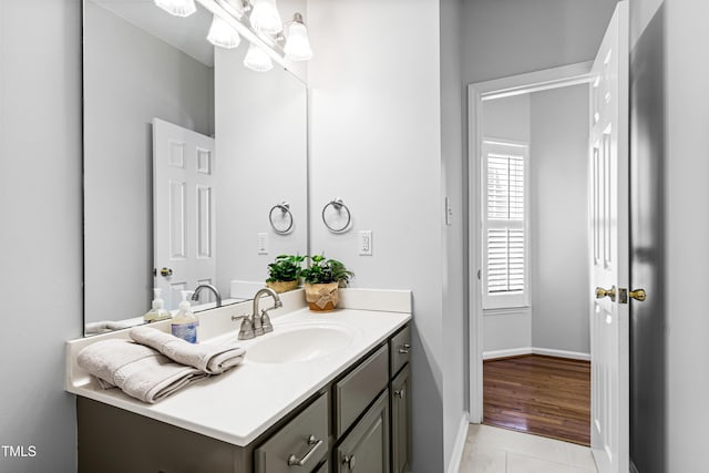 bathroom with tile patterned flooring and vanity