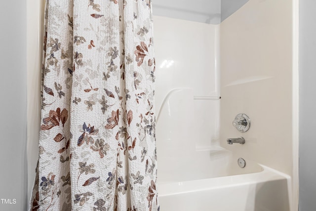 bathroom with shower / bath combo