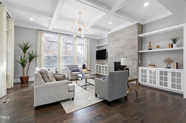 living room with built in shelves, dark hardwood / wood-style flooring, beamed ceiling, and coffered ceiling