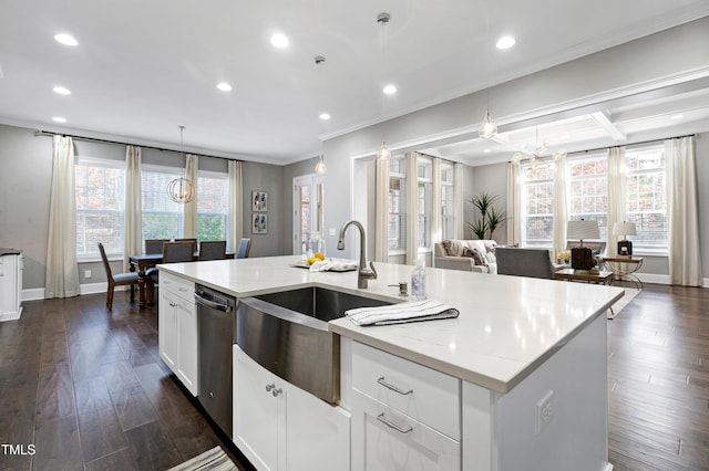 kitchen with white cabinets, a kitchen island with sink, pendant lighting, sink, and stainless steel dishwasher