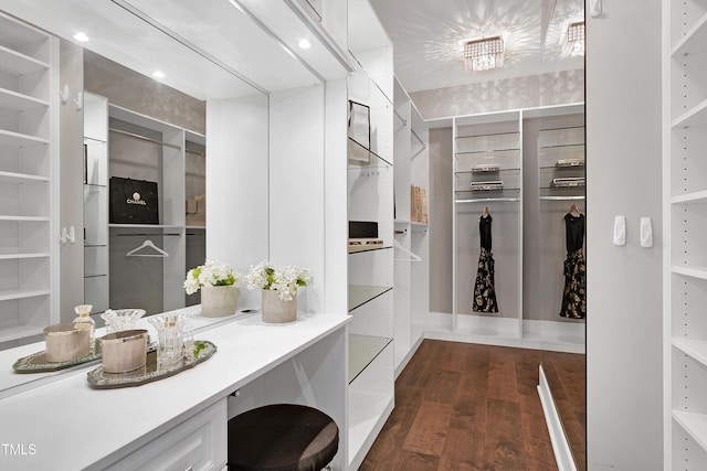 walk in closet featuring dark wood-type flooring