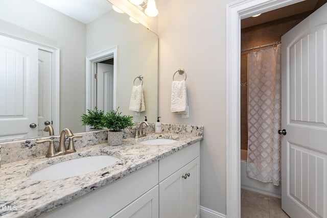 bathroom featuring tile patterned floors, vanity, and shower / bath combination with curtain