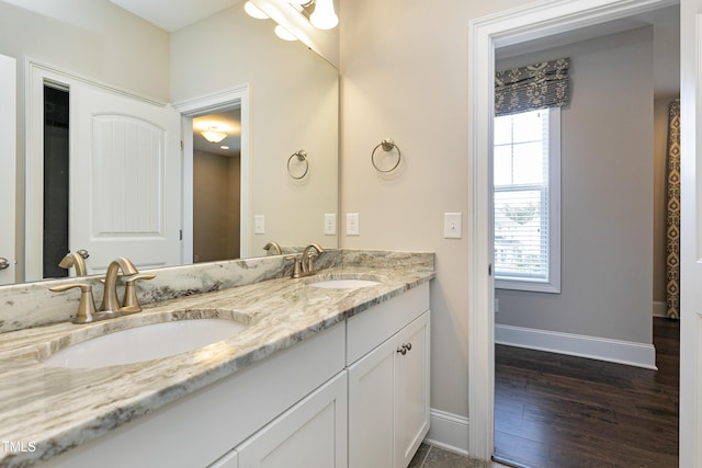 bathroom featuring vanity and hardwood / wood-style flooring