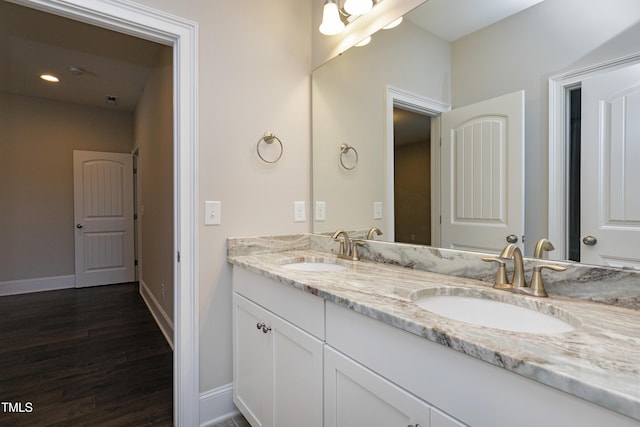 bathroom featuring vanity and wood-type flooring