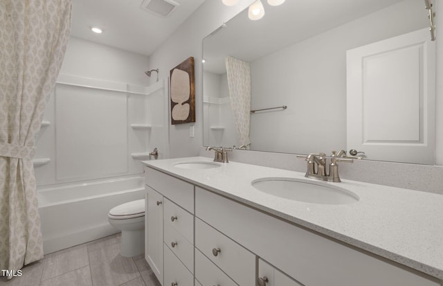 full bathroom with vanity, shower / tub combo with curtain, tile patterned floors, and toilet