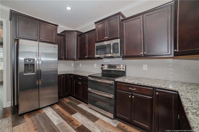 kitchen with stainless steel appliances, light stone counters, dark hardwood / wood-style floors, backsplash, and crown molding