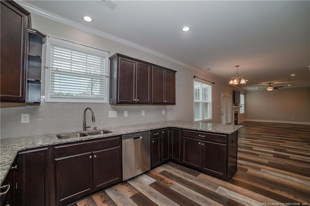 kitchen featuring kitchen peninsula, stainless steel dishwasher, ceiling fan with notable chandelier, sink, and dark hardwood / wood-style floors