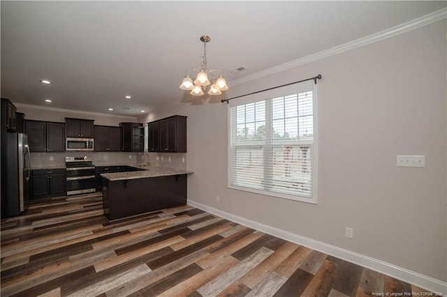 kitchen with tasteful backsplash, ornamental molding, dark brown cabinets, stainless steel appliances, and an inviting chandelier