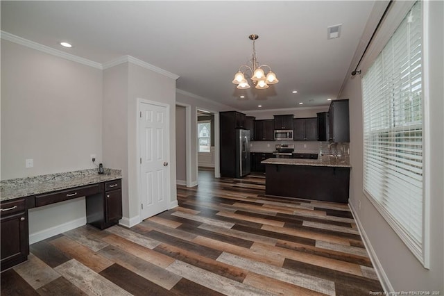 kitchen featuring ornamental molding, a notable chandelier, dark hardwood / wood-style flooring, dark brown cabinetry, and stainless steel appliances