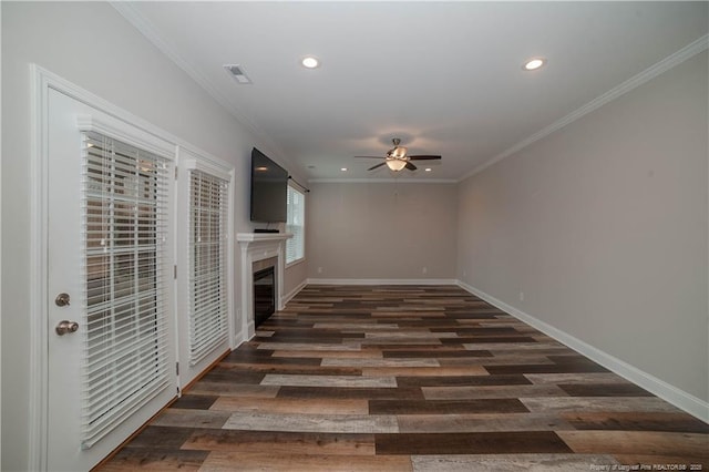 unfurnished living room featuring ceiling fan, dark hardwood / wood-style flooring, and ornamental molding