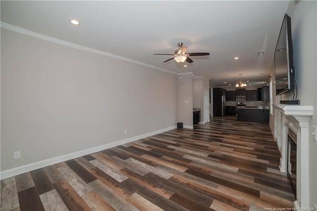 unfurnished living room with crown molding, dark hardwood / wood-style floors, and ceiling fan with notable chandelier