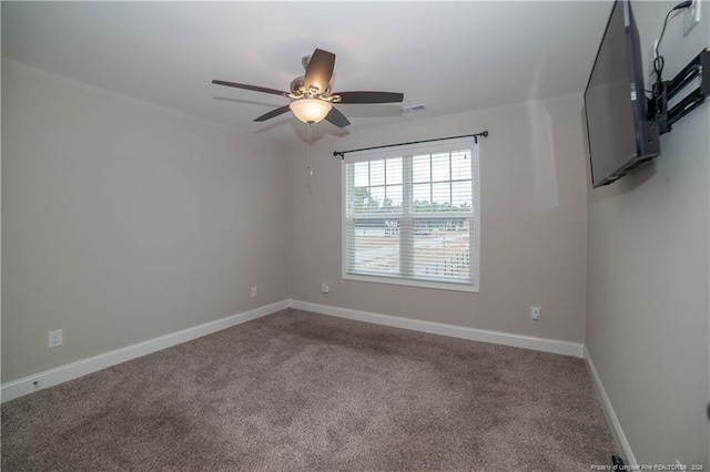 empty room featuring carpet flooring and ceiling fan