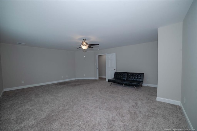 unfurnished room with ceiling fan and light carpet