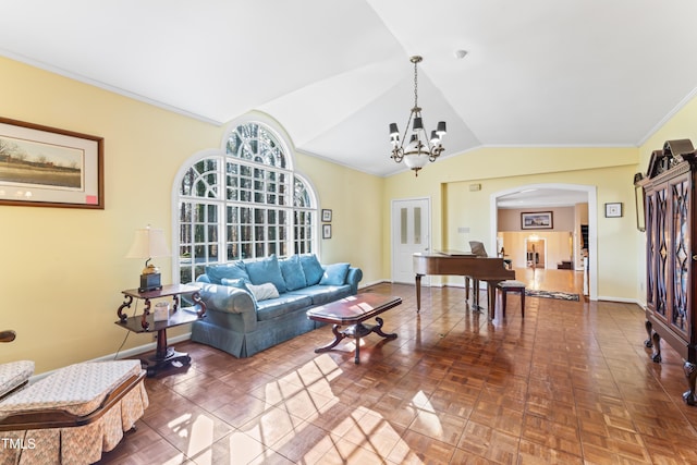 living room featuring an inviting chandelier, ornamental molding, lofted ceiling, and parquet floors