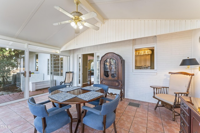 sunroom with lofted ceiling with beams and ceiling fan