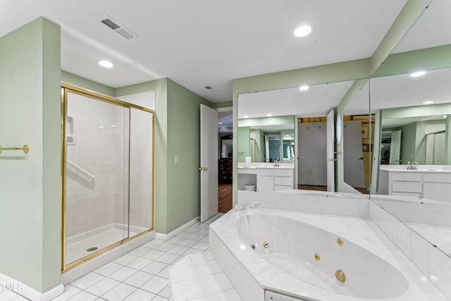 bathroom with tile patterned floors, independent shower and bath, and vanity