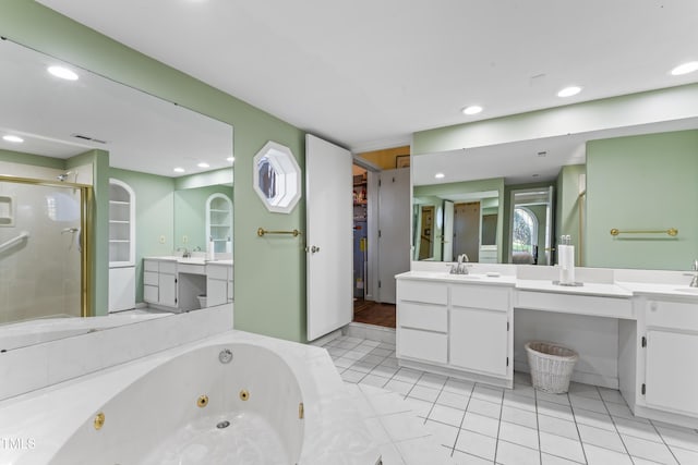 bathroom featuring tile patterned floors, vanity, and separate shower and tub