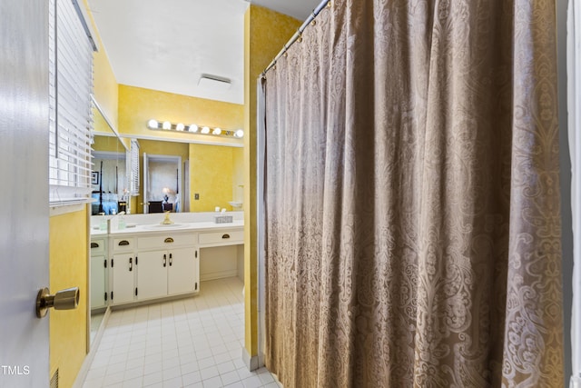 bathroom with vanity and tile patterned flooring