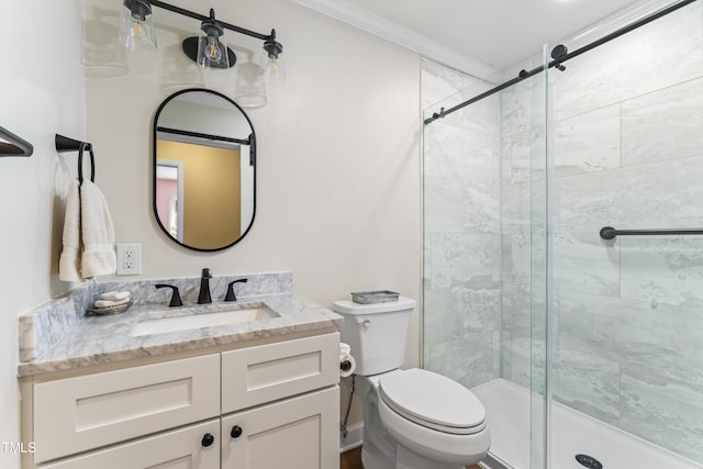 bathroom with vanity, a shower with shower door, ornamental molding, and toilet