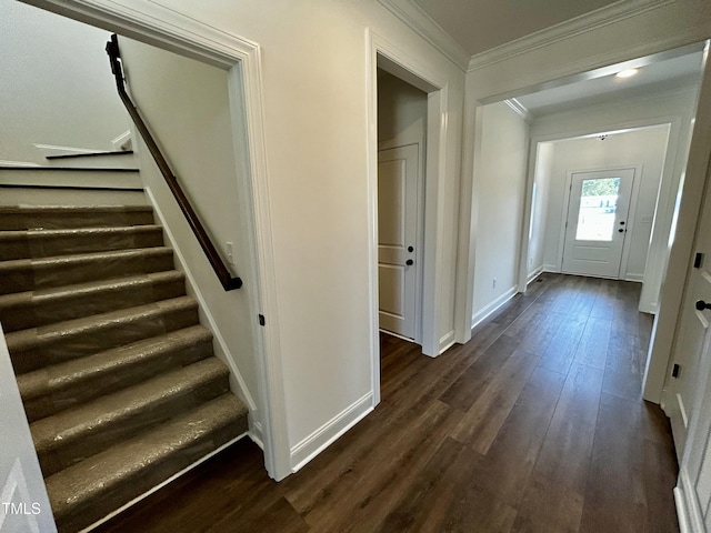 interior space with dark wood-style floors, ornamental molding, stairway, and baseboards