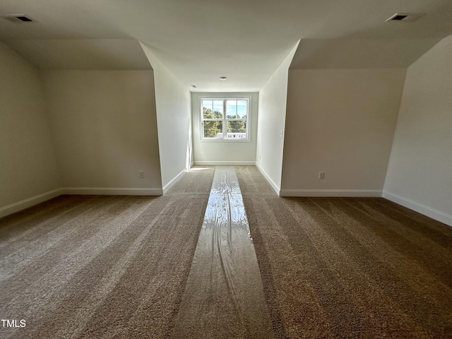 bonus room featuring visible vents and baseboards