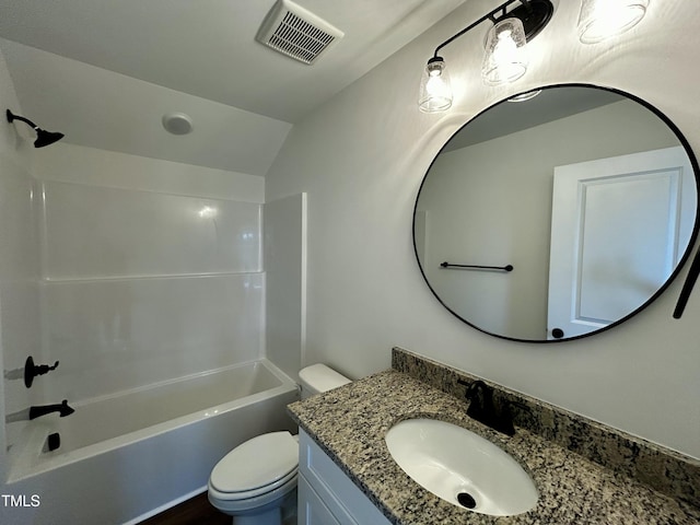 full bathroom with visible vents, toilet, washtub / shower combination, vaulted ceiling, and vanity