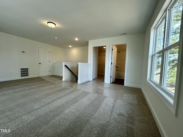 interior space with baseboards, visible vents, and recessed lighting