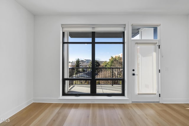 spare room featuring light hardwood / wood-style floors