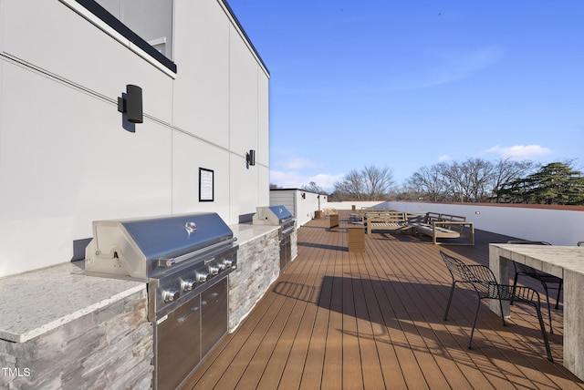 deck featuring area for grilling and grilling area