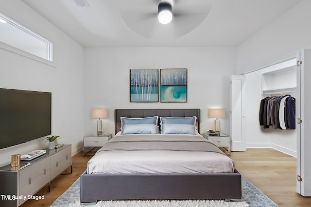 bedroom featuring ceiling fan and light wood-type flooring