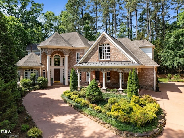 71012 Russell, Chapel Hill, NC 27517 - view of front of property with brick siding, roof with shingles, and covered porch