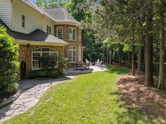 71012 Russell, Chapel Hill, NC 27517 - view of grassy yard with a patio area