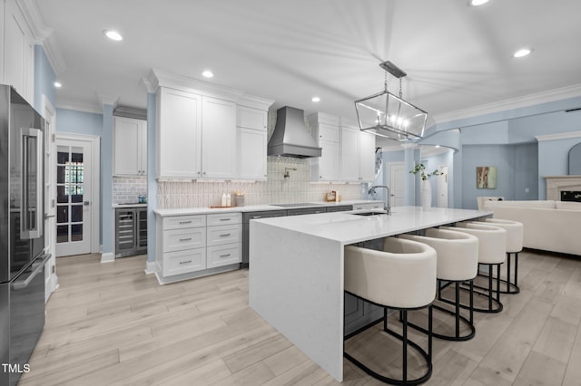 71012 Russell, Chapel Hill, NC 27517 - kitchen with custom range hood, beverage cooler, a sink, high end refrigerator, and ornamental molding