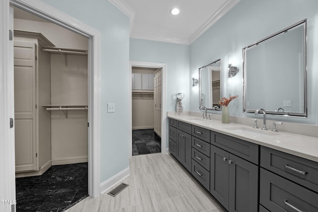 71012 Russell, Chapel Hill, NC 27517 - bathroom featuring double vanity, ornamental molding, baseboards, a spacious closet, and recessed lighting