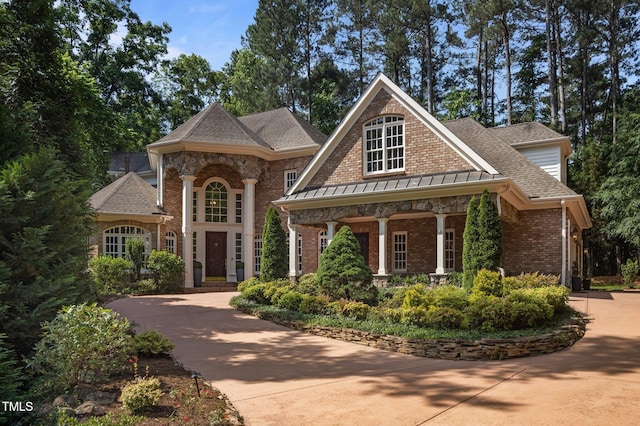 71012 Russell, Chapel Hill, NC 27517 - view of front of property featuring brick siding and a shingled roof