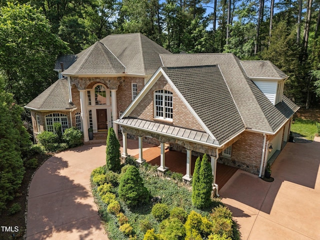 71012 Russell, Chapel Hill, NC 27517 - view of front of home with stone siding, brick siding, roof with shingles, and driveway