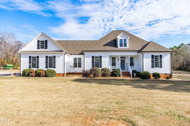 view of front of house with a front lawn and a porch