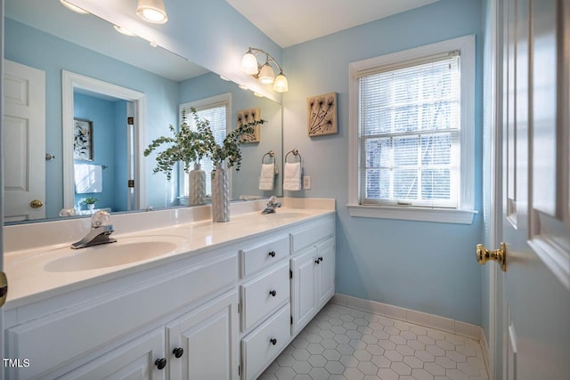 bathroom with tile patterned floors and vanity