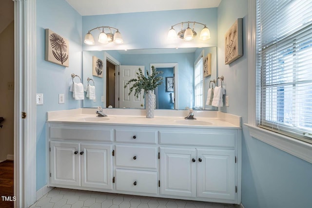 bathroom with tile patterned floors and vanity