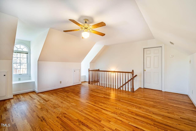 bonus room with ceiling fan, light wood-type flooring, and lofted ceiling