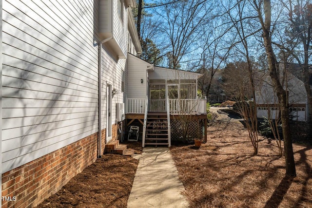 view of side of property with a sunroom