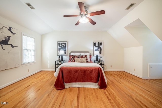 bedroom with lofted ceiling, ceiling fan, and light hardwood / wood-style flooring