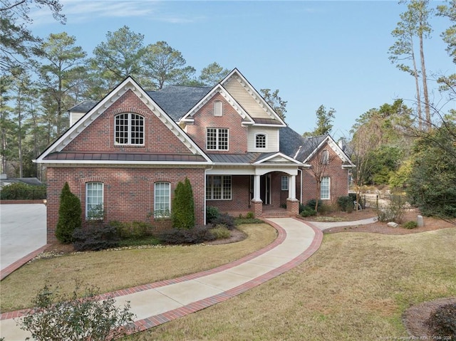 craftsman-style house featuring a front yard and a porch