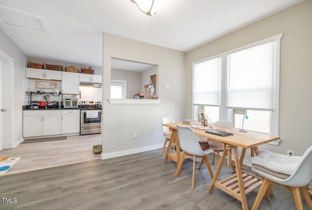 dining area with light hardwood / wood-style flooring